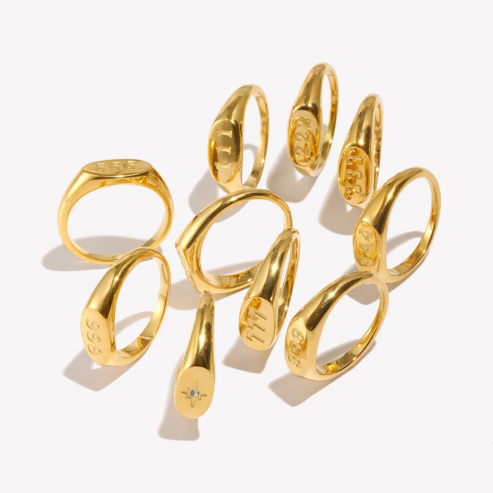 Set of gold rings with unique designs on a white background